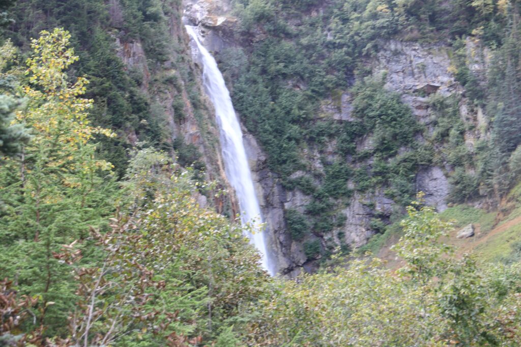 tennis tourist smithers bc waterfall wide shot